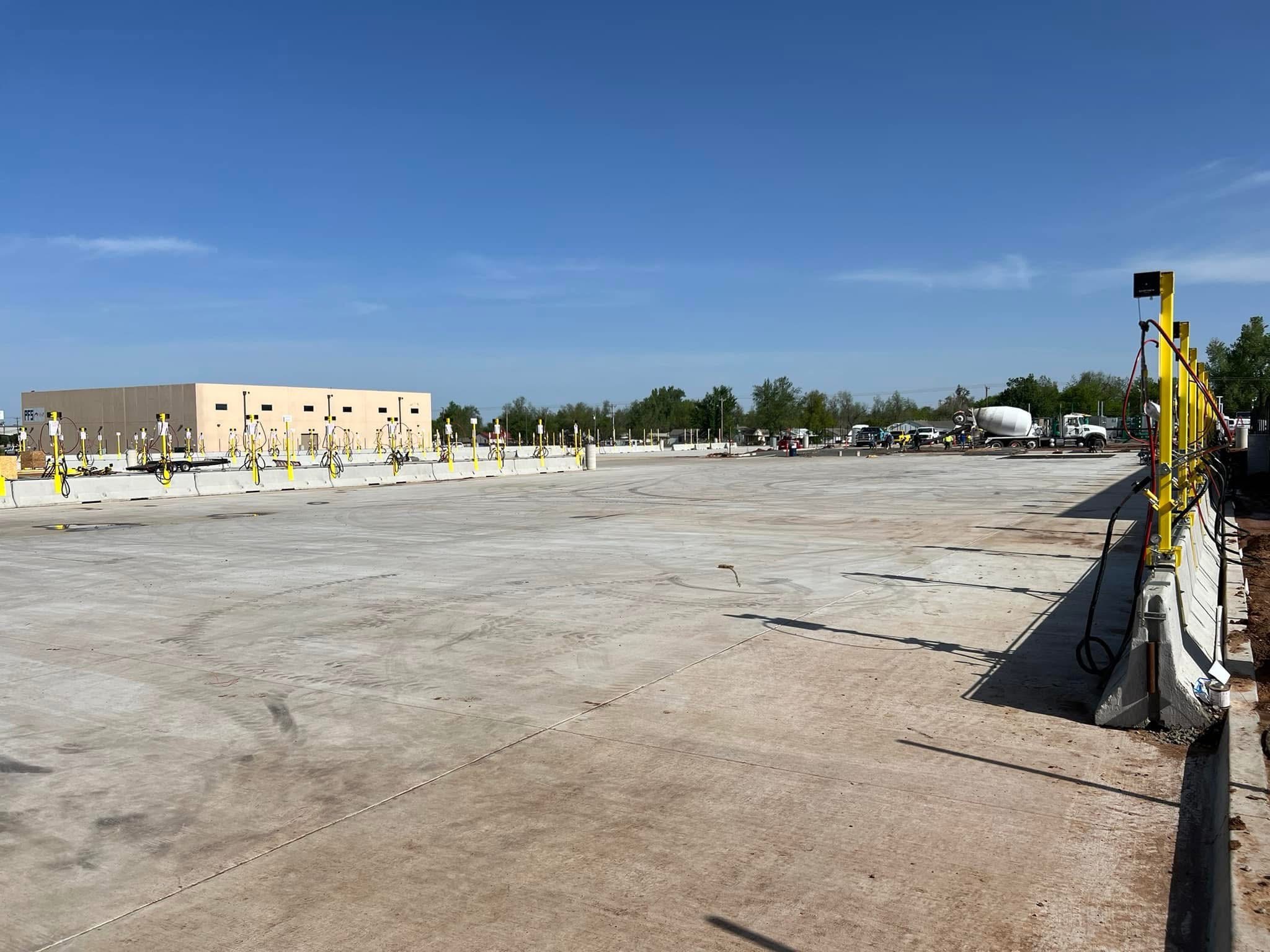 Excavator loading a haul truck at the Amazon fleet fueling facility site